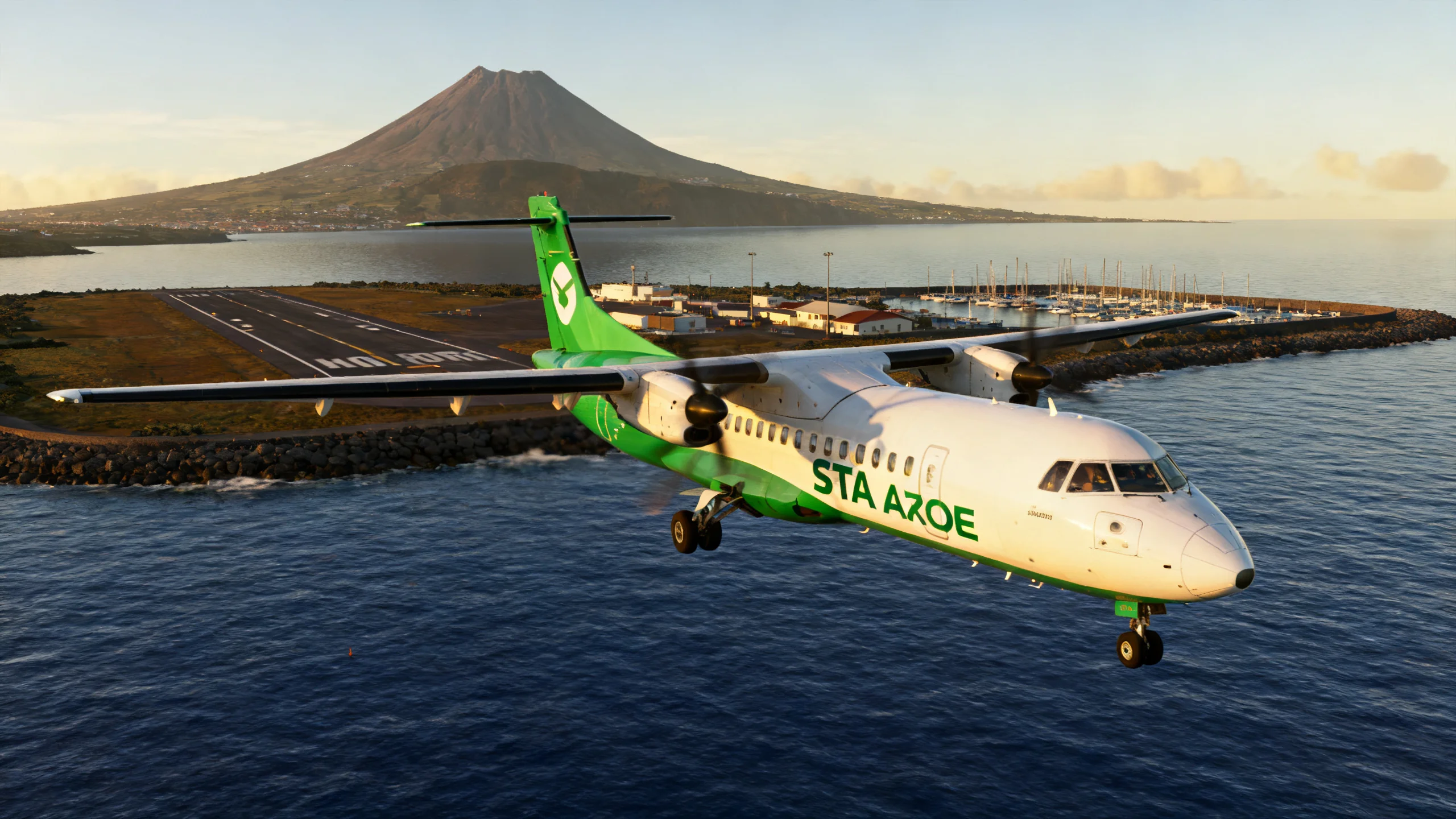 A SATA Azores Airlines turboprop landing at Horta Airport on Faial, the marina and the Pico volcano visible in the background across the channel, deep blue Atlantic water around the small airfield, soft afternoon light